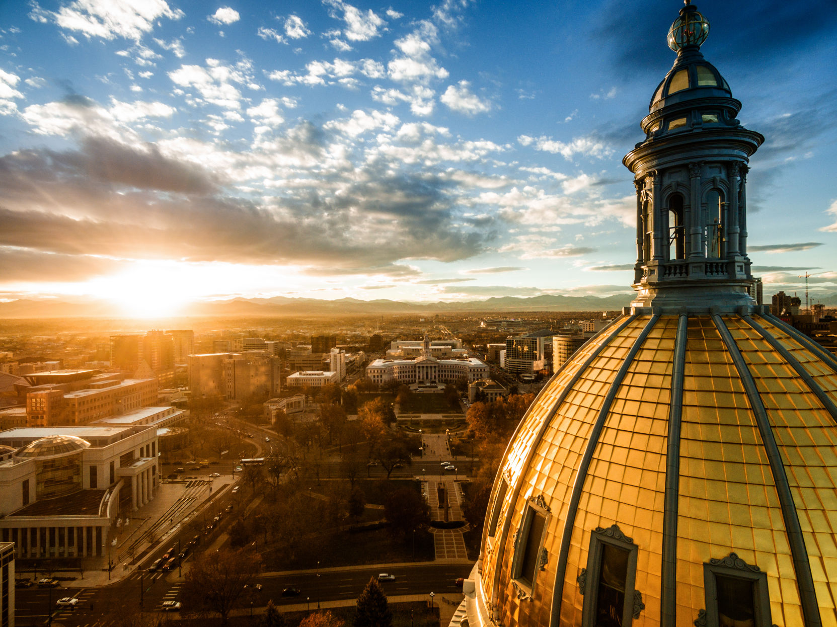 The Colorado state Capitol at sunset as seen from a drone.